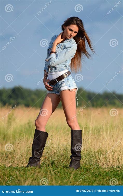 The Woman In Jeans Shorts In The Field Stock Image Image Of Natural