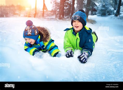 Children Playing In Snow At Snowfall Stock Photo Alamy