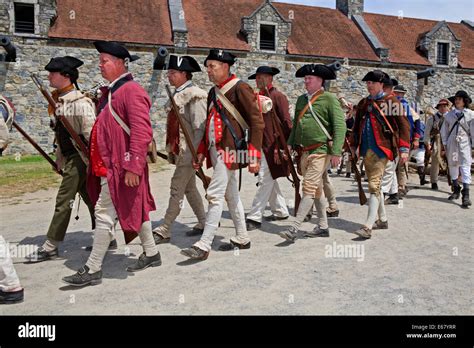 American Revolutionary War Reenactors Marching Off To A Battle Stock