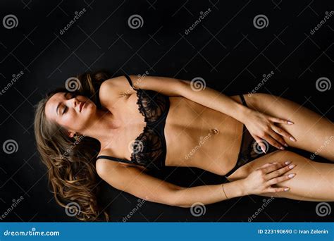 Beautiful And Seductive Woman Wearing Black Lingerie Stock Photo