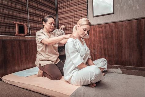 Professional Female Masseuse Massaging Her Clients Shoulders Stock Image Image Of Trip