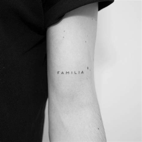 Familia Lettering Tattoo On The Bicep