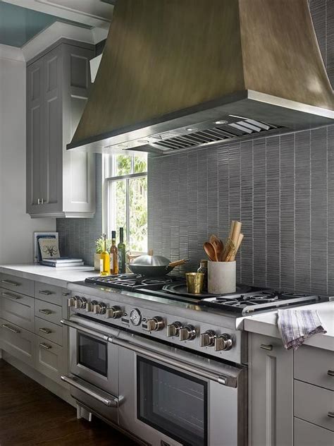 You can choose from plenty of different. Gray Kitchen Cabinets with Silver Backsplash Tiles ...
