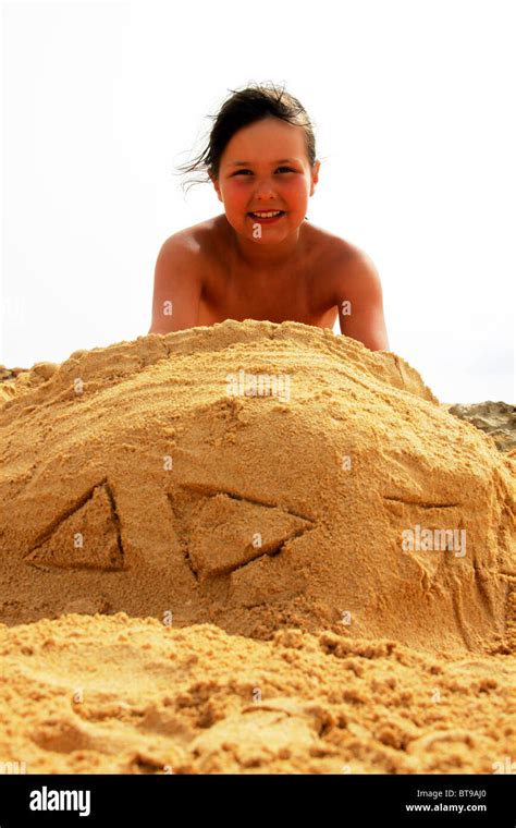 Young Girl Playing In Sand Boat On Beach Stock Photo Alamy