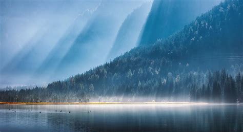 Mountains In Bright Sunbeams And Foggy Photograph By Denys Bilytskyi
