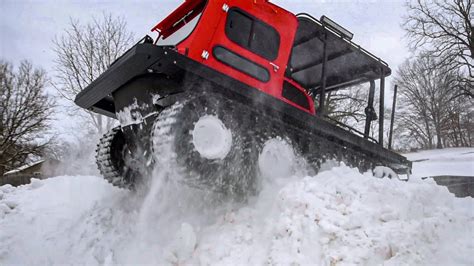 Bashing Snow Piles In The Mudd Ox Amphibious Atv Youtube