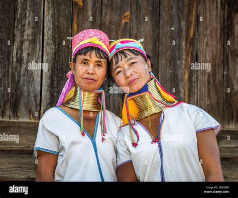 Two Padaung Women In Traditional Dress And With Metal Rings Around