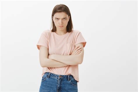 free photo angry sulking woman looking offended cross arms chest and frowning at you