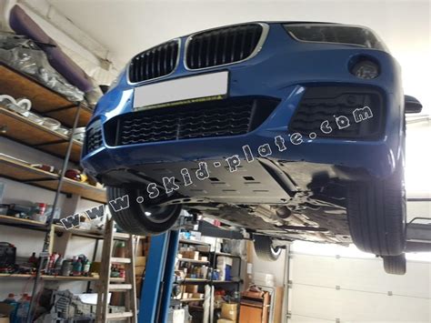 Make sure special tool 2 411 719 engages with special tool 2 413 082. Steel skid plate for BMW X1 F48