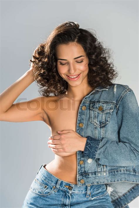 Laughing Topless Girl In Jeans Touching Hair Isolated On Grey Stock Image Colourbox