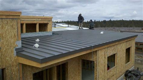 Exterior Flat Metal Roof Designed In Dark Gray Color Applied In