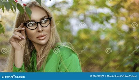 Pretty Blonde Woman With Elegant Glasses Is Posing Outdoors Stock Image