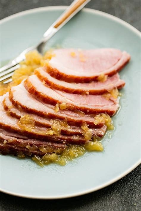 Pineapple Glazed Ham Slices Served On A Plate With A Fork And Extra