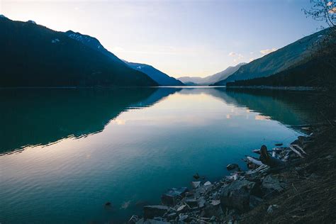 Lake With Turquoise Water And Mountains At Sunset Photograph By