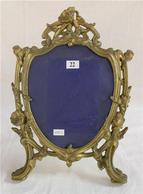 If a picture frame is hung well on a wall then it can create an interesting focal point within a room so do the parallel frames meaning as you go up the stairs, the pictures are always at face height. A brass picture frame, of Art Nouveau design. Height 35.5 ...
