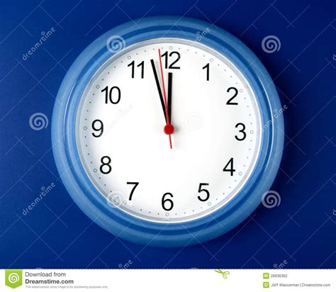 Clock About To Hit Midnight Or Noon On Blue Backgr Stock