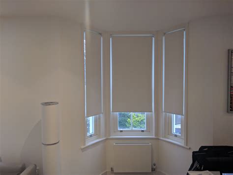 Blackout roller blinds fitted to bay window in Kensington, London