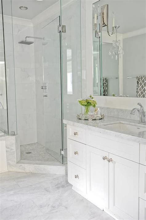 Wrapping a white bathroom vanity in cabinetry maximizes storage in a home with limited closet space. Going for this look. Light grey floor tiles, white vanity ...