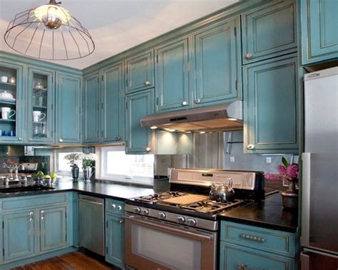 Kitchens and bathrooms are focal points in any home, and nothing detracts from the unique beauty of a log home like having standard cabinets from a local home center. Turquoise Kitchen | Houzz