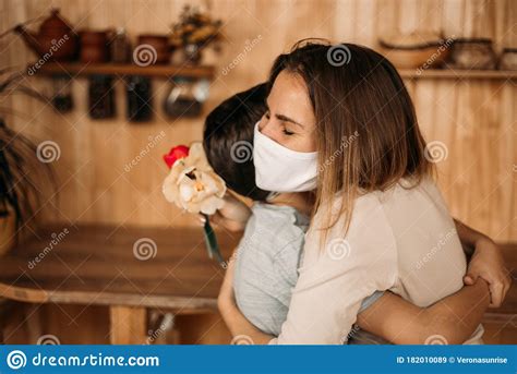Masked Mom Hugs Masked Son Happy Family In Quarantine Stock Image Image Of Lifestyle