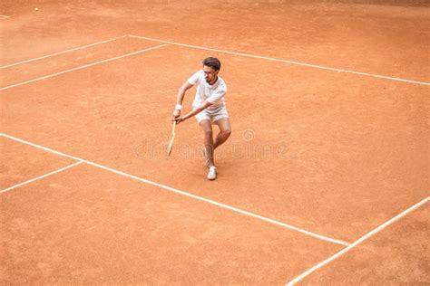 Retro Styled Male Tennis Player With Racket Playing Game Stock Image