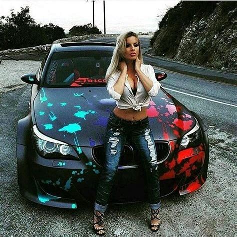 Blonde Model In Jeans And High Heels Posing On Bmw Hood In Bmw