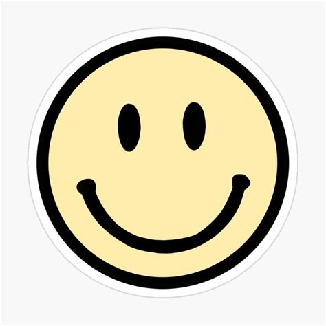 A Smiley Face Sticker On A White Background