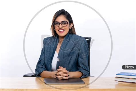 Image Of Smiling Indian Confident Young Woman Working With A Laptop