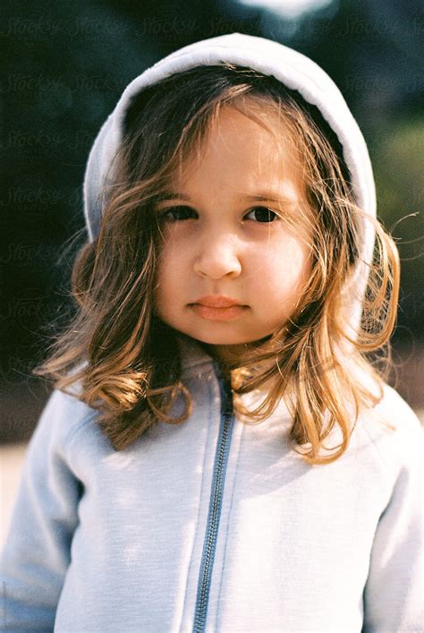 Portrait Of A Cute Young Girl With Big Cheeks Wearing A Hoodie By Jakob