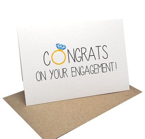 A Stylish Handmade Engagement Card Featuring A Engagement Ring Within