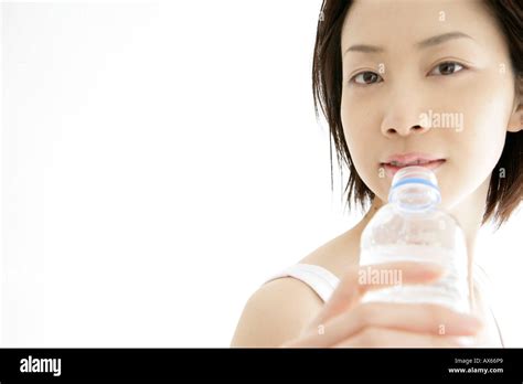 Front View Of A Young Woman Drinking Water After Her Exercise Stock