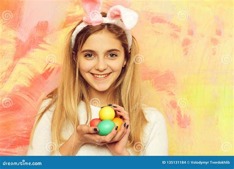 Happy Easter Girl In Bunny Ears With Colorful Painted Eggs Stock Photo