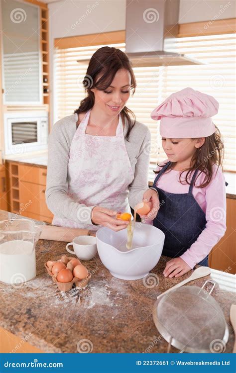 Portrait Of A Happy Mother And Her Daughter Baking Stock Image Image Of Flour Casual 22372661