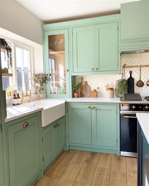 You can brighten up the space with a coat of white, or blast the room with a vibrant color like cobalt. mint green kitchen with gold hardware in 2020 | Green ...