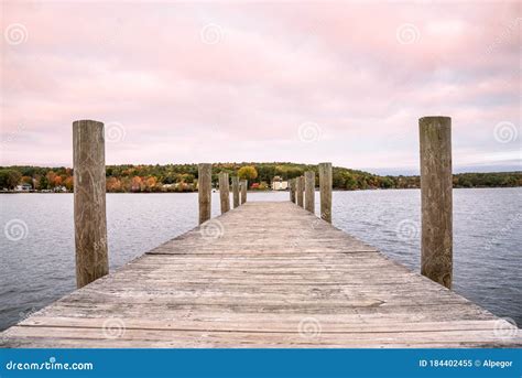 Empty Pier On A Lake Under Colourful Sky At Dusk Stock Image Image Of