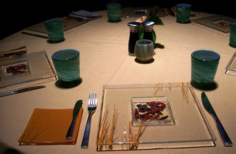 Setting a table with napkins, plates, silverware, and glasses is not as difficult as it seems. Thai table setting at Saffron, Banyan Tree Macau