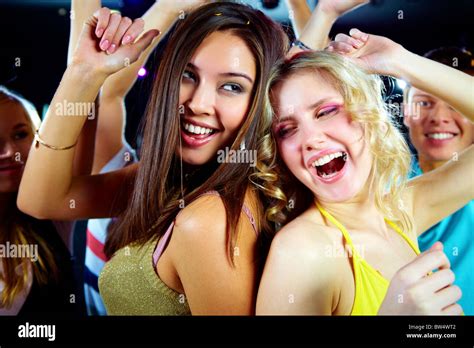 Two Joyful Girls Dancing In Night Club And Having Fun Stock Photo Alamy