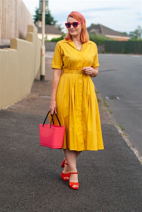 A Classic Yellow Summer Dress Styled With Red And Pink