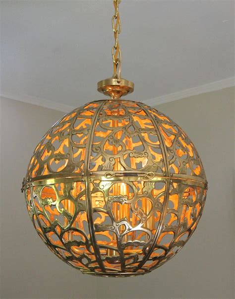 Shoji paper softens the harsh light from incandescent or compact fluorescent bulbs, spreading it evenly & beautifully throughout the room. Large Pierced Filigree Brass Japanese Asian Ceiling Pendant Light For Sale at 1stdibs