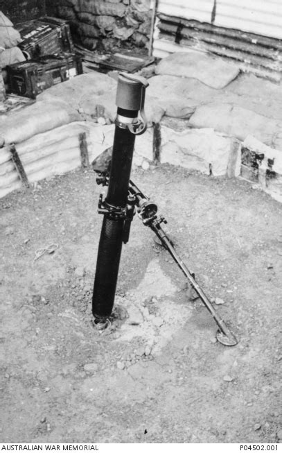 An 81mm Mortar Positioned In A Weapon Pit That Has Been Lined With