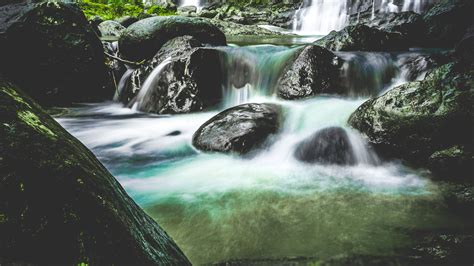 Waterfalls Over Black Stones · Free Stock Photo