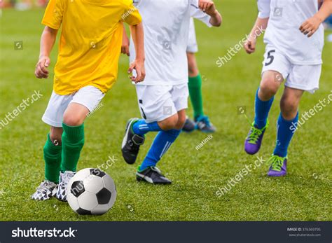 Training And Football Match Between Youth Soccer Teams Young Boys