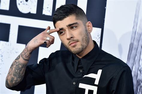 zayn malik slicks down eyebrows as he poses in truth shirt at straight outta compton premiere