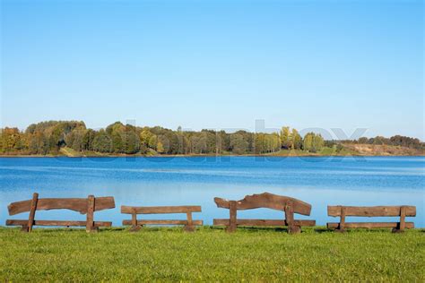 Four Wooden Benches At The Lake Stock Image Colourbox