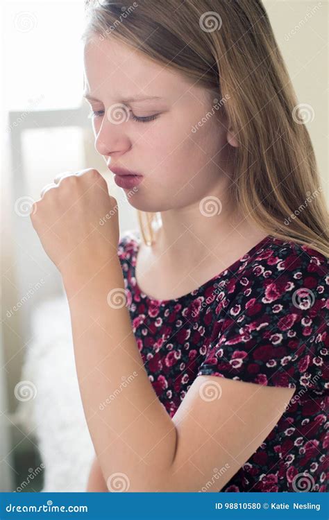 Girl Suffering With Cough Sits On Bed At Home Stock Photo Image Of