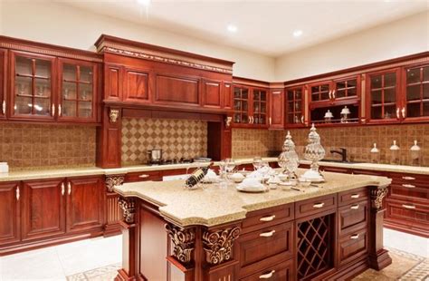 Cherry wood comes in different shades. Cherry Kitchen Cabinets With Gray Wall And Quartz ...