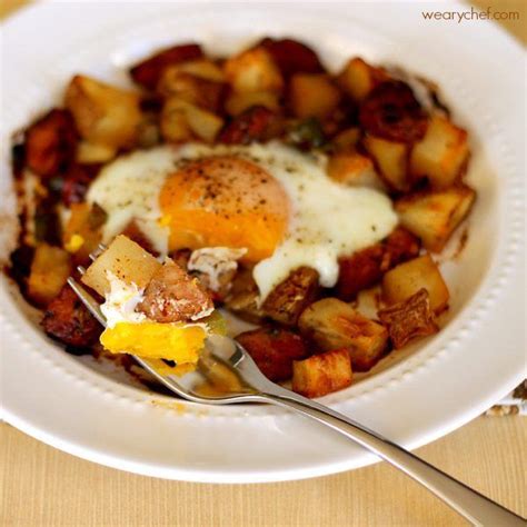 Baked Egg Over Roasted Potatoes And Sausage The Weary Chef
