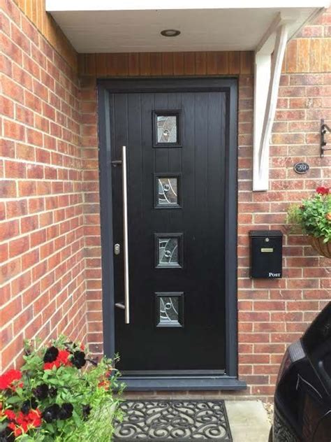 Composite front doors glasgow | with our online door designer your stunning and unique composite front door can be configured in less than 5 minutes. Contemporary black composite door in a grey outer frame ...