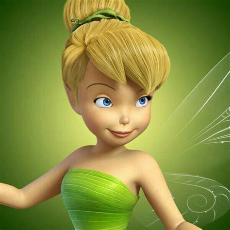 A Cartoon Tinkerbell With Blue Eyes And Blonde Hair Wearing A Green Dress