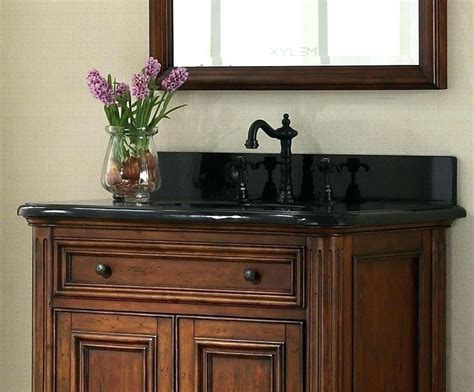 A bathroom vanity unit is a piece of furniture combining the bathroom basin with a useful storage for a stunning black bathroom look, vitra and britton produce modern washstand designs. Black hardware on black countertop | Bathroom vanity tops ...